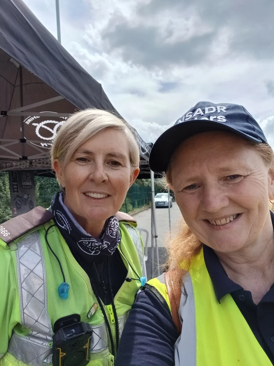 Two event volunteers taking a selfie