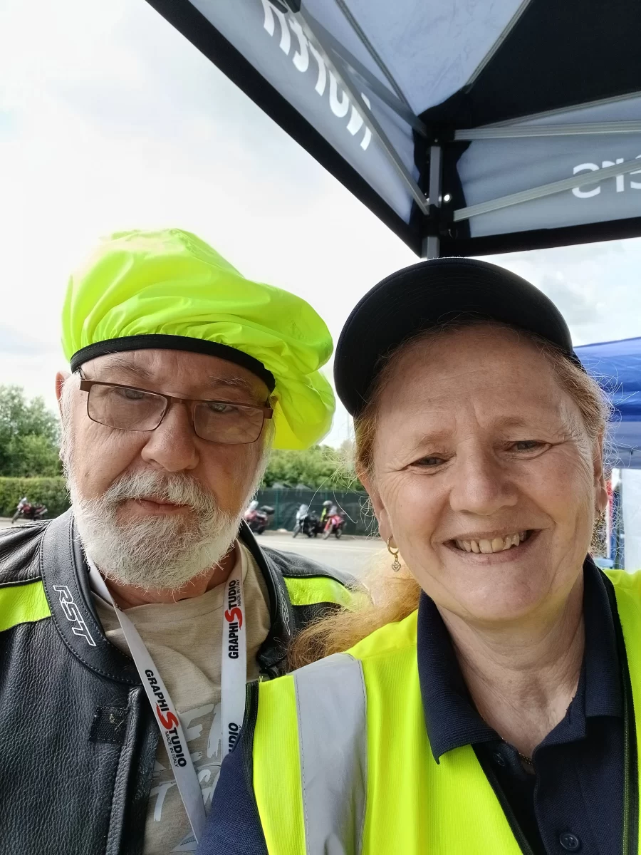Two smiling event attendees taking a selfie