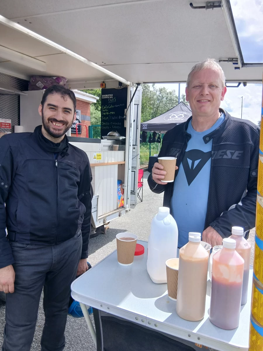 Two riders having drinks at the event