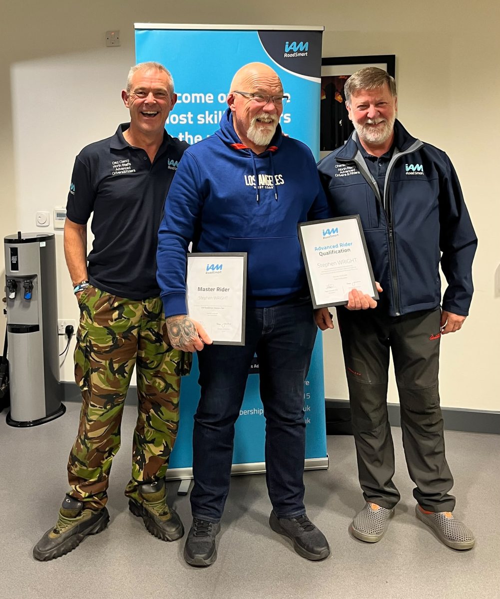 Steve Wright displaying his Master Rider and Advanced Rider certificates with NSADR observers